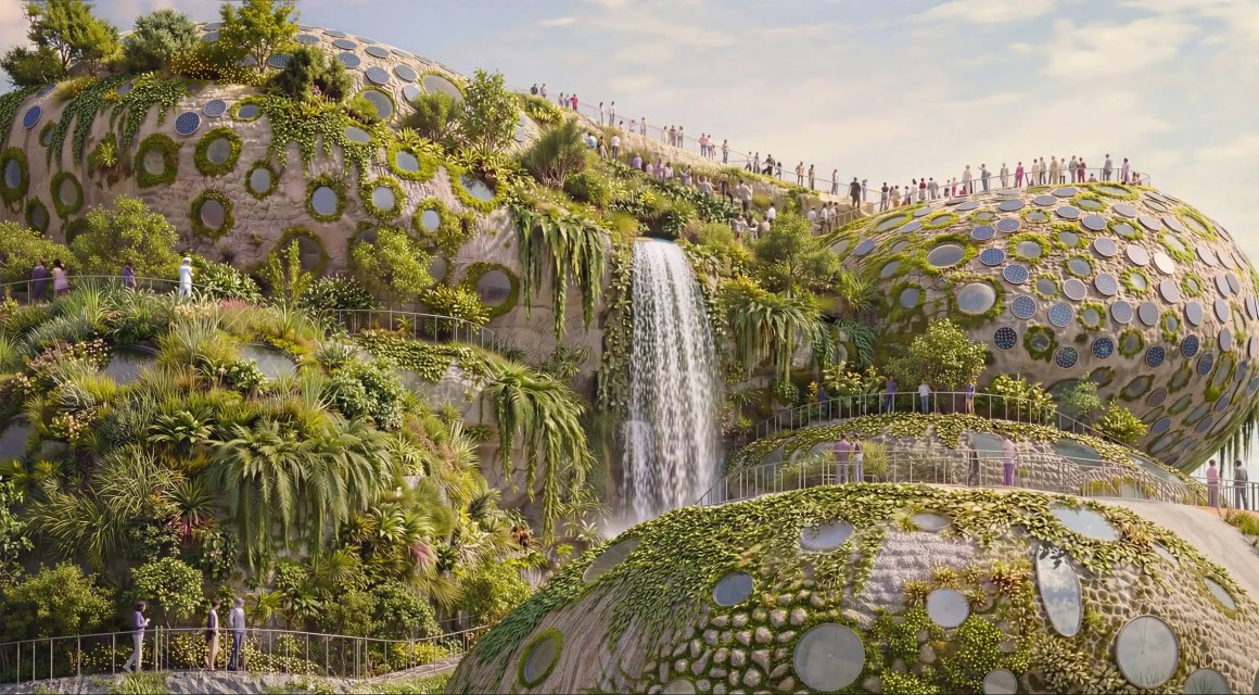 Futuristic landscape featuring dome-shaped structures covered in greenery, with a waterfall cascading down and people walking along paths.