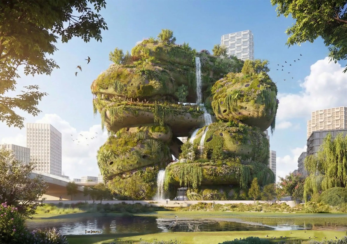 A futuristic building covered in greenery and waterfalls, surrounded by urban architecture, with a pond and trees in the foreground.